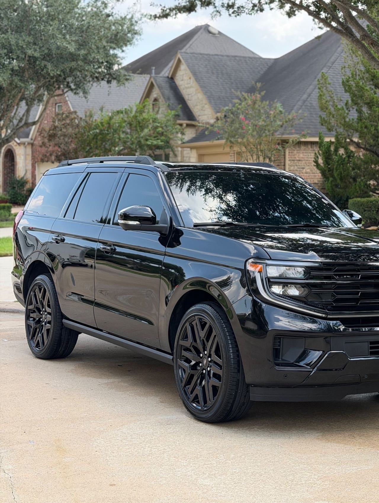 Black Ford Expedition on a driveway after a detail